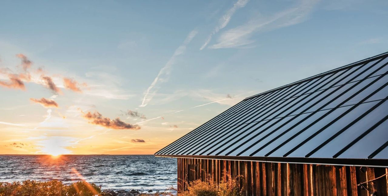 Roofit.Solar standing-seam integrated solar metal roof on a home