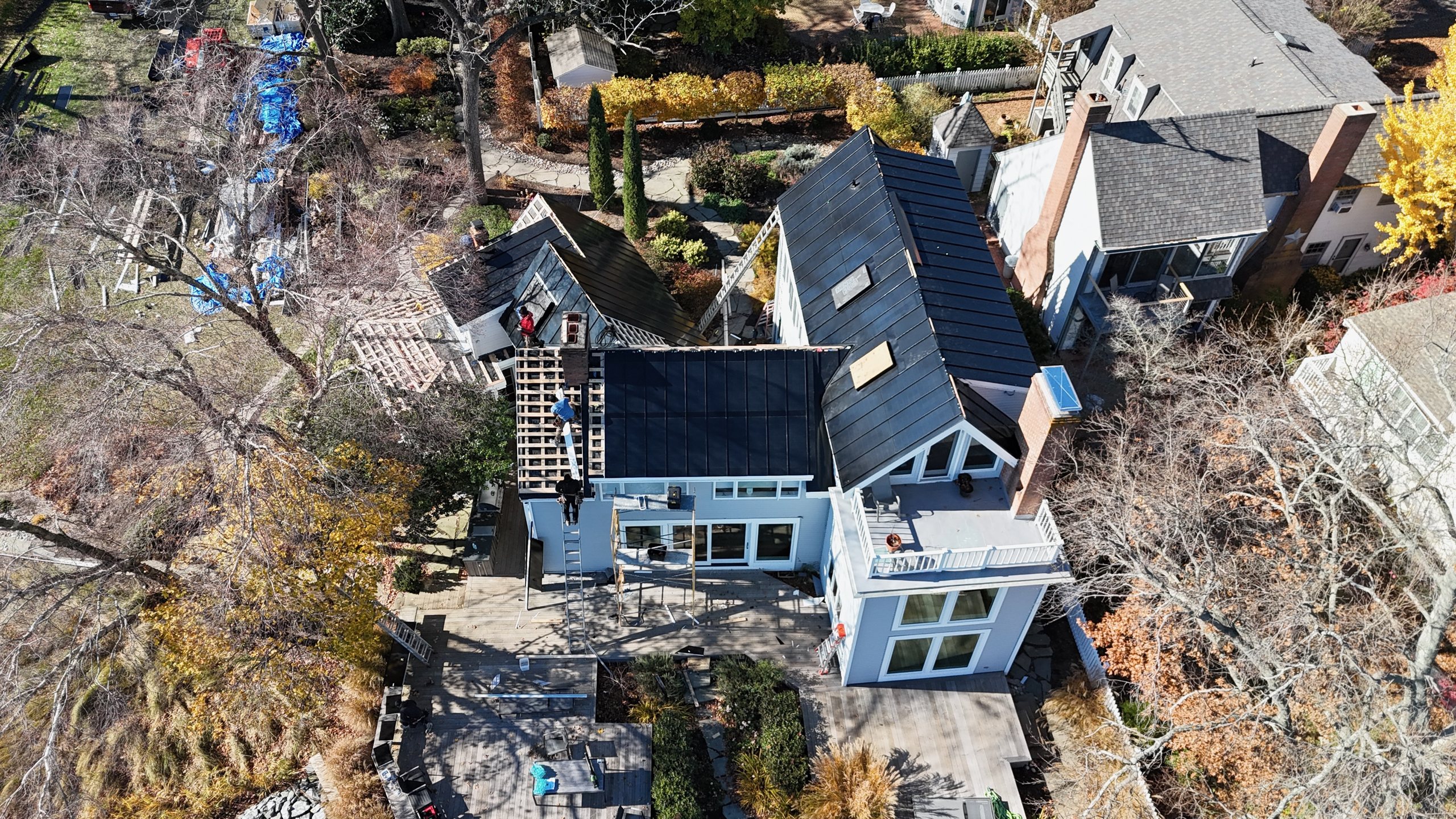 Aerial view of an ArcEdge integrated solar metal roof install underway in Maryland