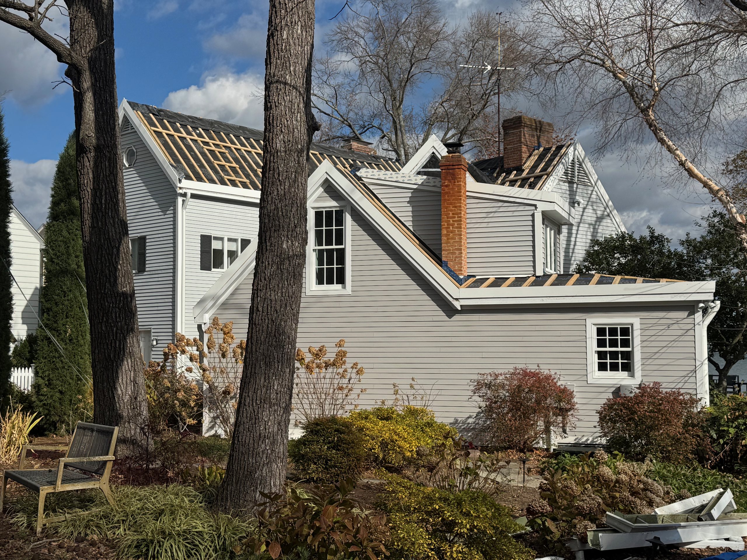 Maryland colonial home mid-way through an ArcEdge solar roof installation